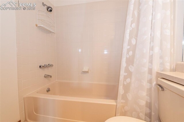 bathroom with toilet and shower / bathtub combination with curtain