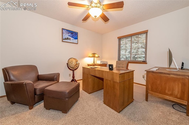 office space featuring light carpet and ceiling fan