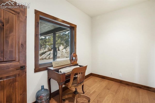 office featuring light wood-type flooring and baseboards