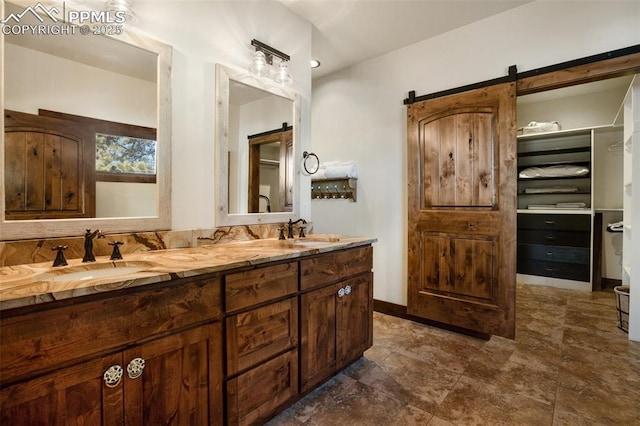 bathroom featuring double vanity and a sink