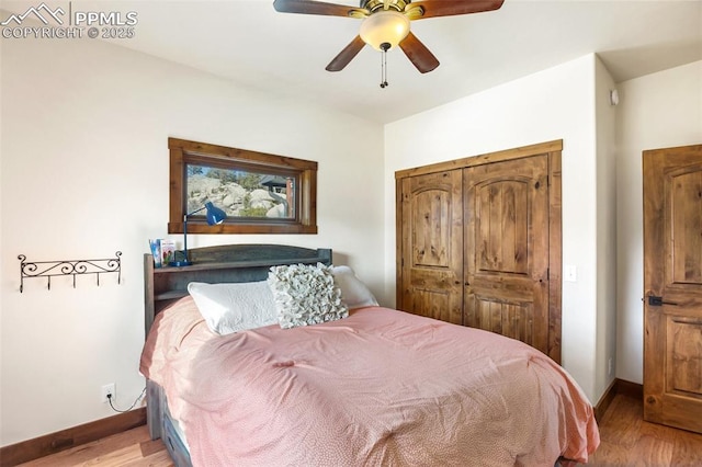 bedroom featuring light wood finished floors, ceiling fan, and baseboards