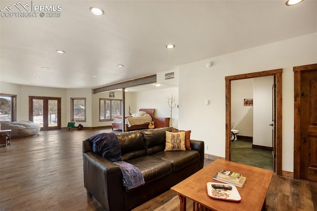 living area with recessed lighting, wood finished floors, visible vents, baseboards, and french doors