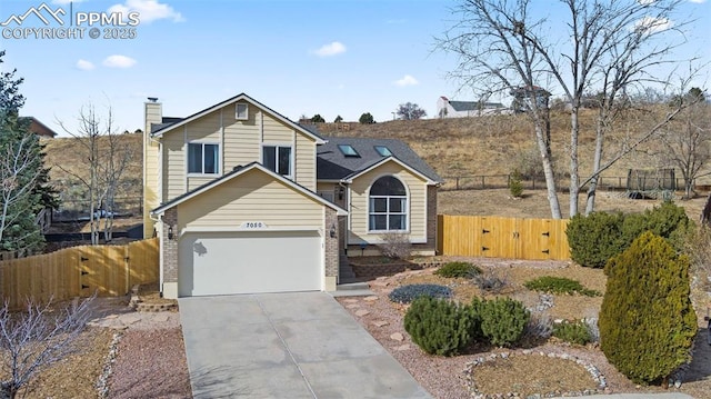 front facade with a garage