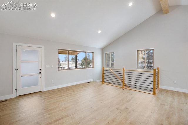 living room featuring beamed ceiling, light hardwood / wood-style floors, and high vaulted ceiling