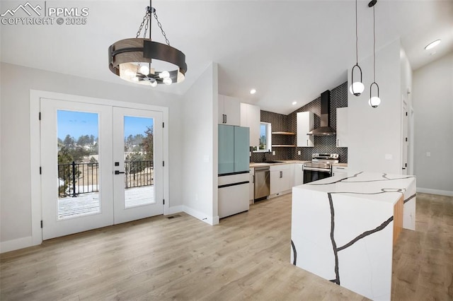 kitchen featuring pendant lighting, white cabinets, stainless steel appliances, and french doors