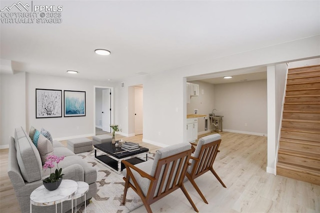 living room with light hardwood / wood-style flooring