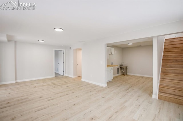 basement featuring light wood-type flooring