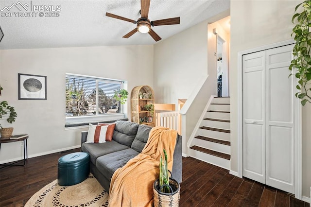 living room with ceiling fan, dark hardwood / wood-style flooring, a textured ceiling, and vaulted ceiling