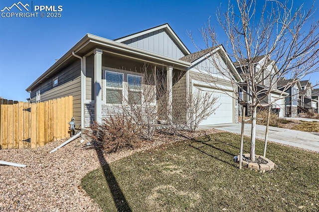 view of front of property featuring a garage and a front lawn