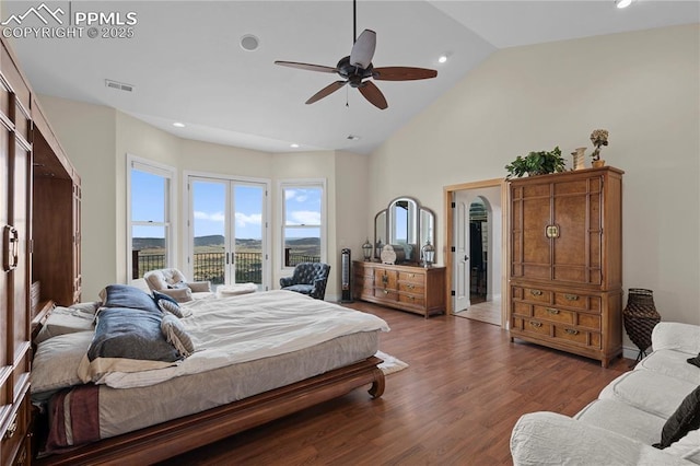 bedroom with access to exterior, ceiling fan, lofted ceiling, and hardwood / wood-style flooring