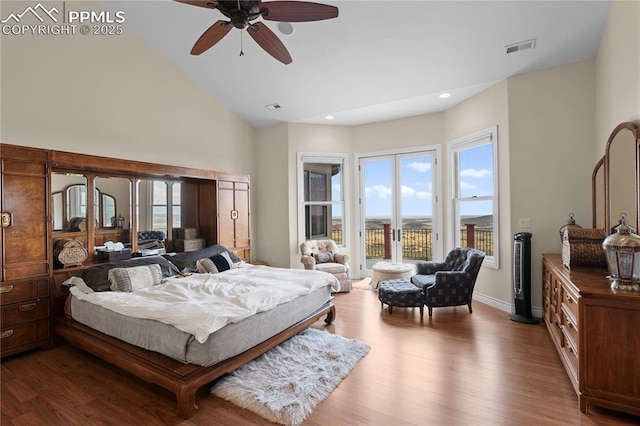 bedroom featuring ceiling fan, wood-type flooring, access to outside, and lofted ceiling