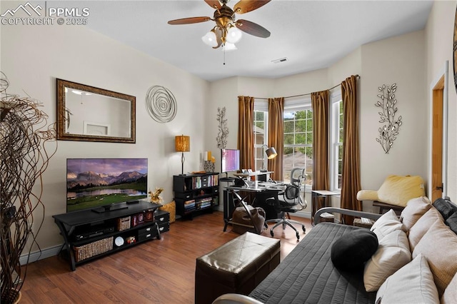 interior space featuring ceiling fan and dark wood-type flooring