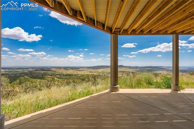 view of patio with a mountain view