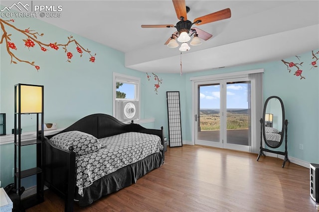 bedroom with hardwood / wood-style flooring, ceiling fan, and access to exterior