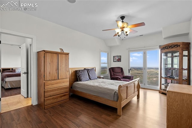 bedroom with ceiling fan, light hardwood / wood-style floors, and access to exterior