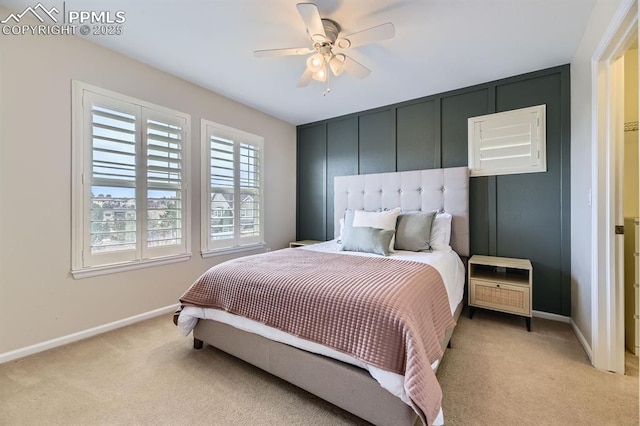 bedroom featuring ceiling fan and light colored carpet