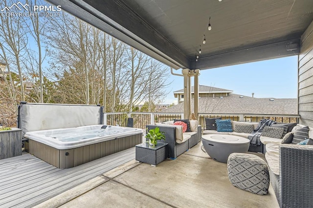 view of patio with an outdoor living space, a covered hot tub, and a wooden deck