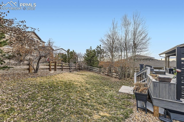 view of yard featuring a wooden deck