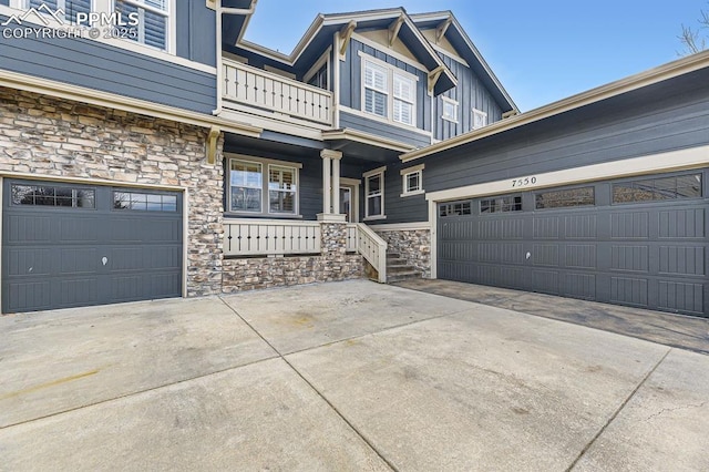 view of front of property with a balcony and a garage