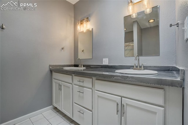 bathroom with tile patterned flooring and vanity