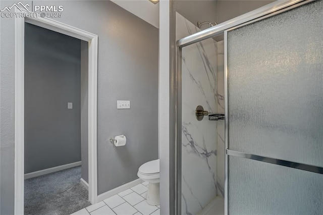 bathroom with tile patterned floors, toilet, and an enclosed shower