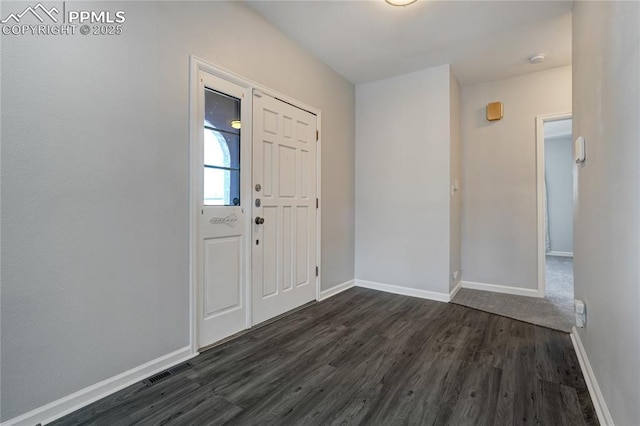 entryway with dark hardwood / wood-style floors