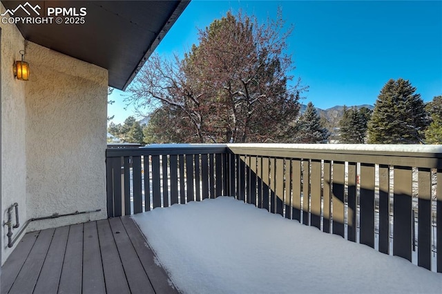 view of snow covered deck