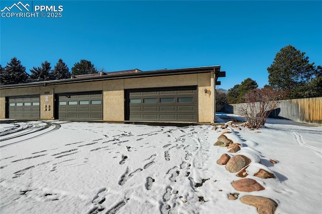 view of snow covered garage