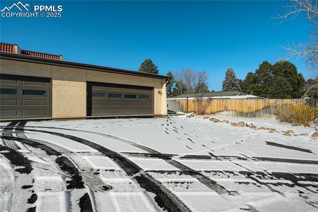 view of snow covered garage