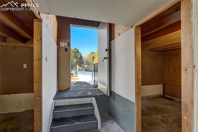 stairs featuring concrete floors