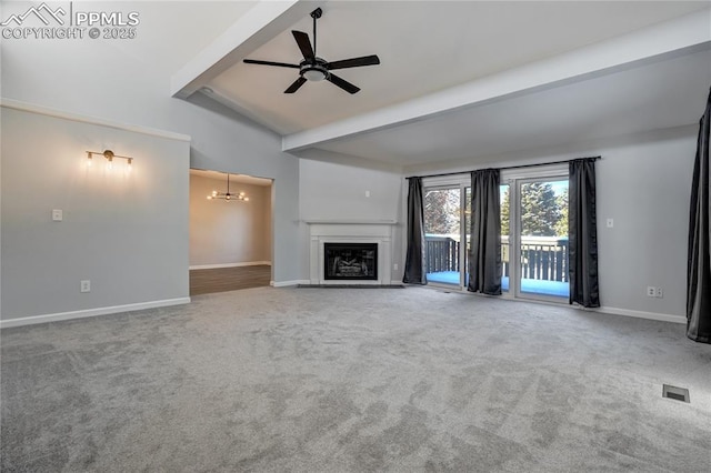 unfurnished living room with carpet, ceiling fan with notable chandelier, and lofted ceiling with beams