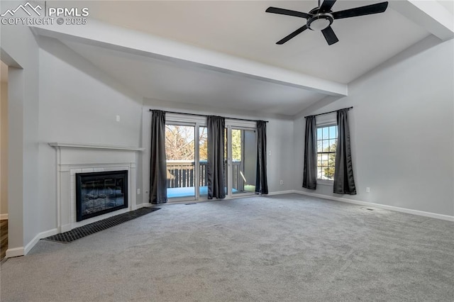 unfurnished living room featuring vaulted ceiling with beams, ceiling fan, and carpet floors