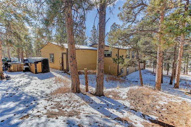 13264 Teller County Rd, Florissant, CO 80816 - snowy yard featuring a hot tub