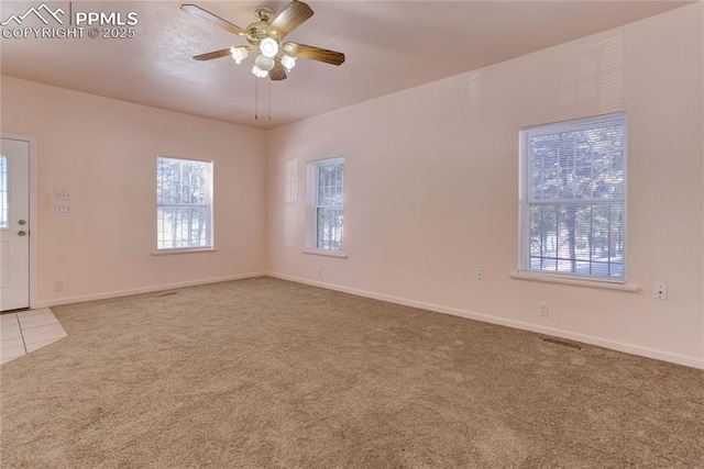 carpeted empty room with ceiling fan