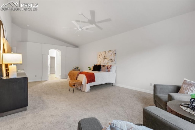 bedroom featuring light colored carpet, vaulted ceiling, and ceiling fan