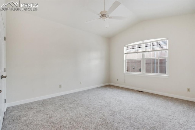 carpeted empty room with ceiling fan and lofted ceiling