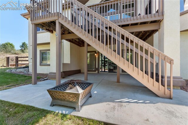 view of patio / terrace with a fire pit