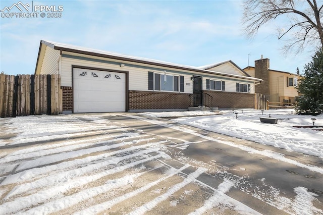 ranch-style home featuring a garage