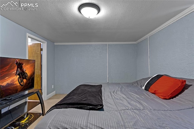 bedroom featuring a textured ceiling and ornamental molding