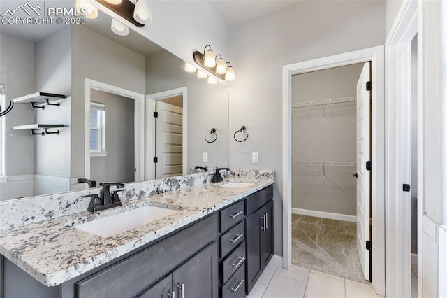 bathroom with tile patterned floors and vanity