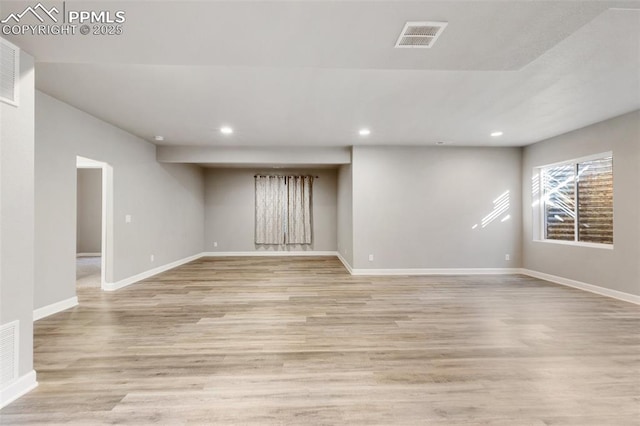 basement featuring light hardwood / wood-style floors