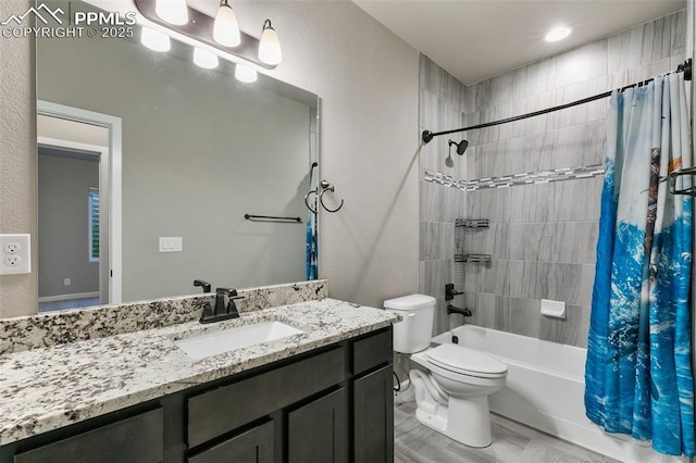 full bathroom with vanity, toilet, and shower / tub combo