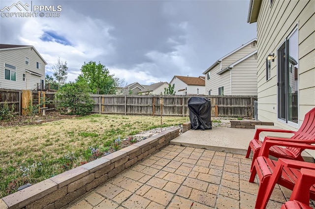 view of patio with a grill