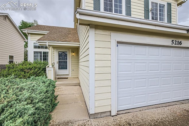 doorway to property featuring a garage