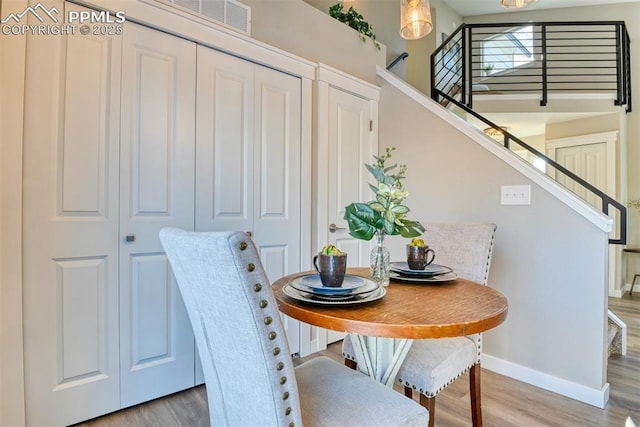 dining space featuring hardwood / wood-style floors