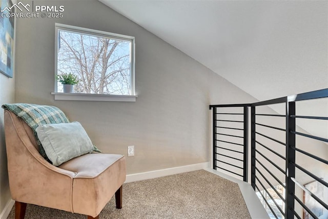 sitting room featuring vaulted ceiling and carpet floors