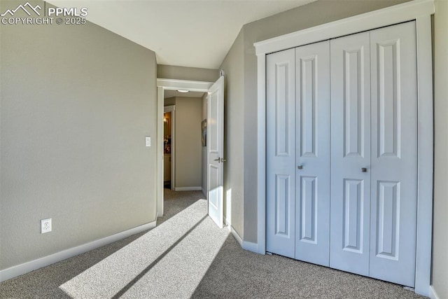 bedroom with a closet and carpet flooring