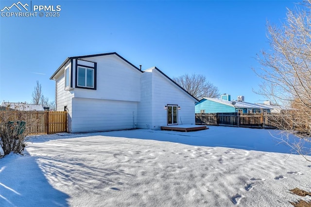 view of snow covered house