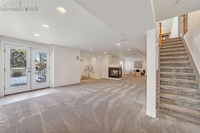 basement with light carpet and french doors