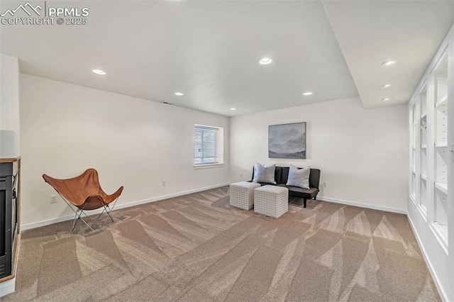 sitting room featuring carpet flooring